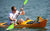 man on yellow kayak