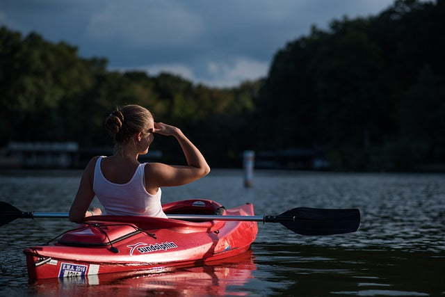 woman on red kayak