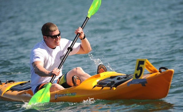 man on yellow kayak
