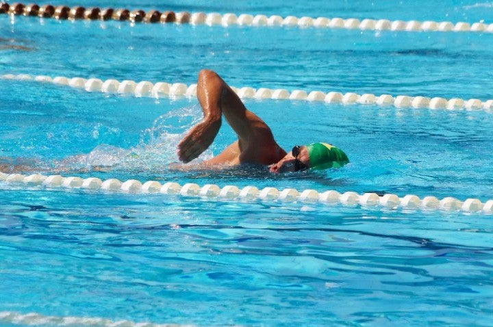 man swimming with a nose clip 
