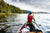 boy wearing a life jacket on a river