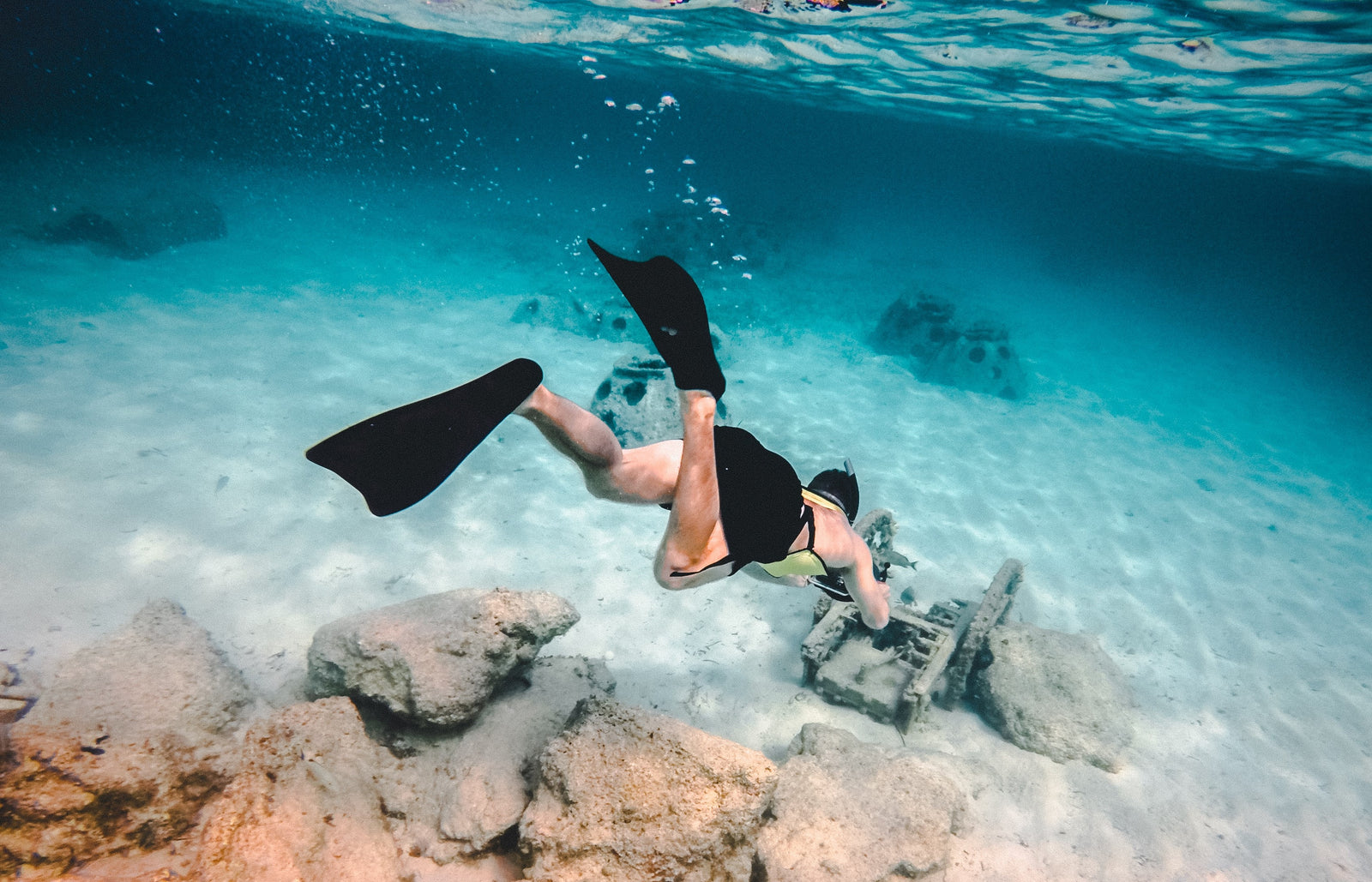 underwater swimmer with black flippers 