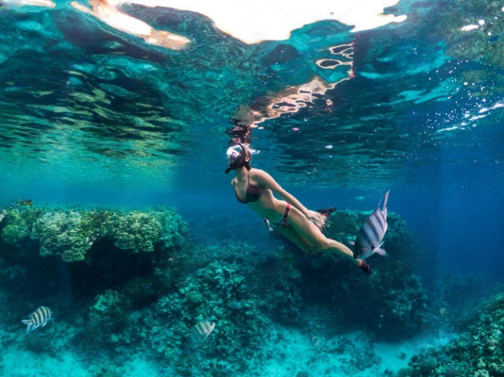 woman snorkeling as exercise 